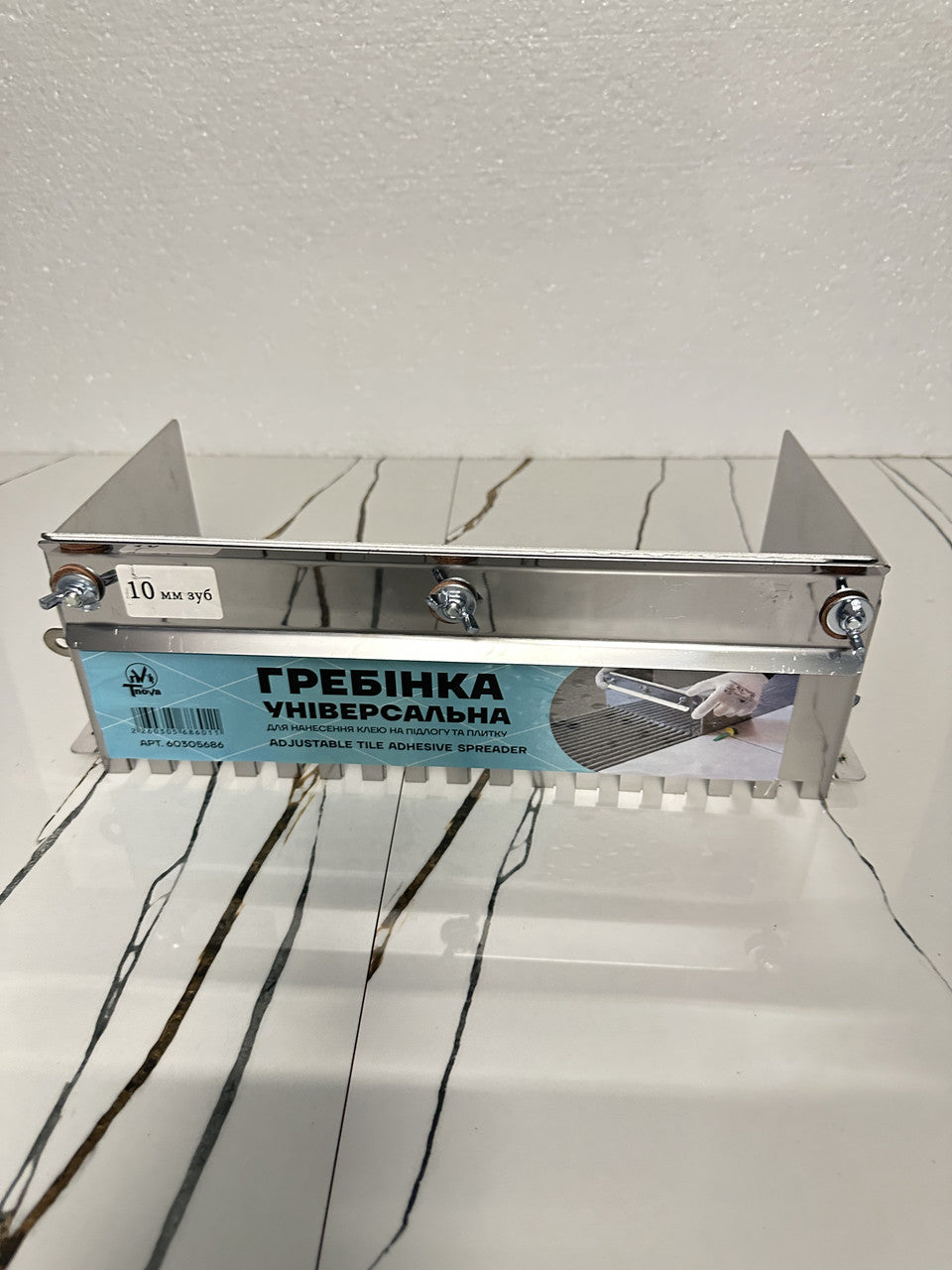Sliding notch trowel for tile laying 10*10 mm, thickness 1 mm