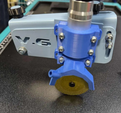 Attachment on carriage for straight cut for Pomagator engraver on Sigma Kera-Cut system